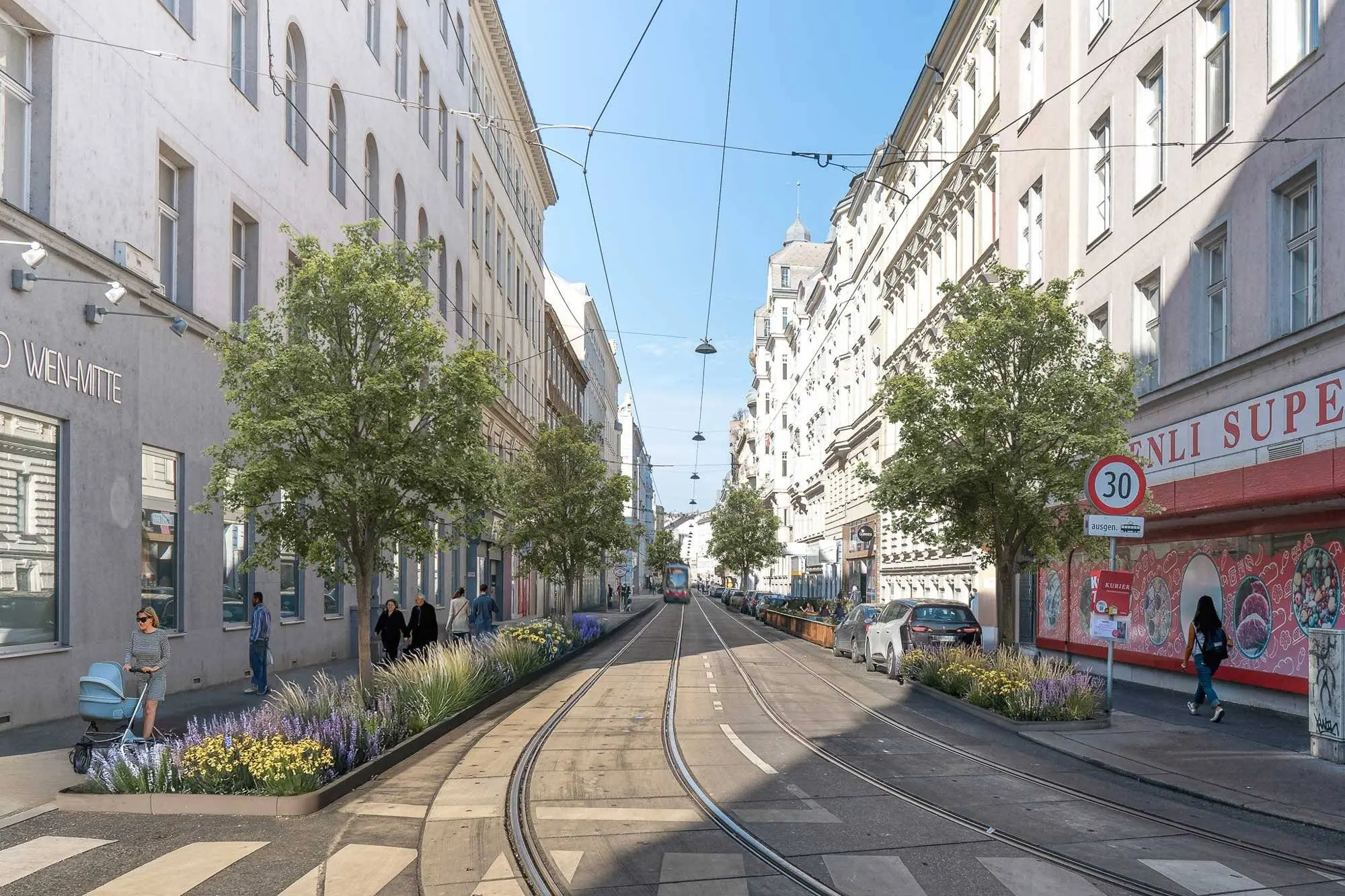 Straßen in Wien-Landstraße mit Bäumen, Radwegen, Sitzplätzen und Fußgänger:innen