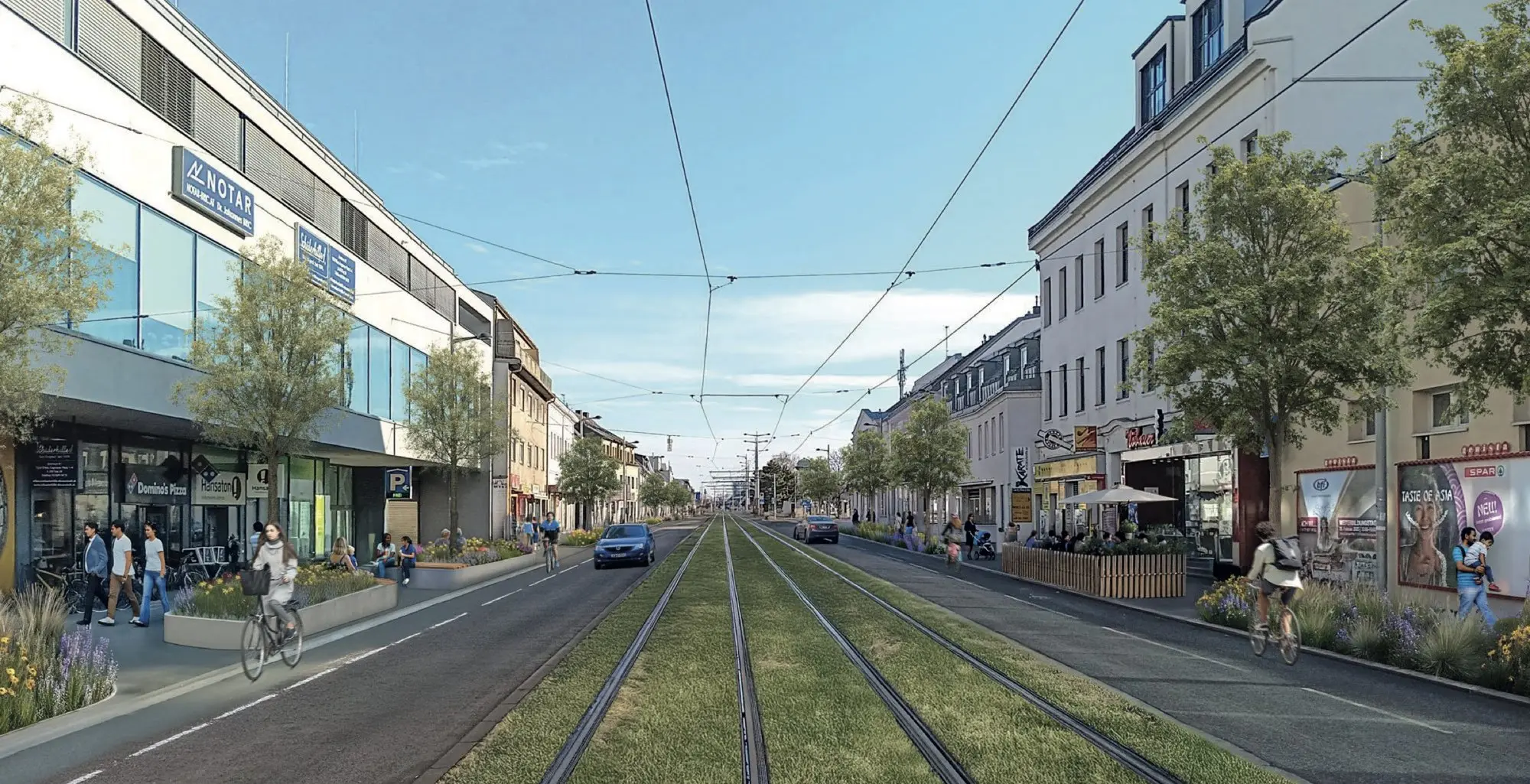 Der Rennweg in Wien mit rotem Radweg, Bäumen und Beeten