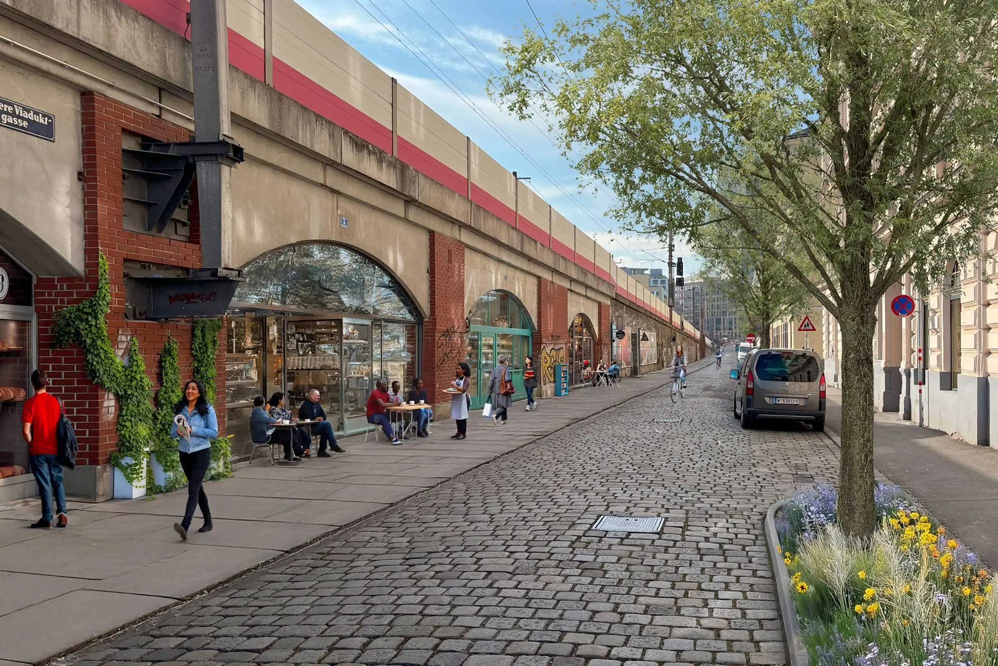 Straßen in Wien-Landstraße mit Bäumen, Radwegen, Sitzplätzen und Fußgänger:innen